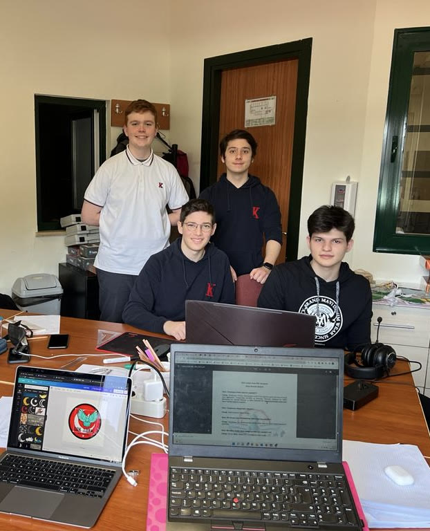 High-school teammates working together around laptops during the GÖK-TÜRK UAV project