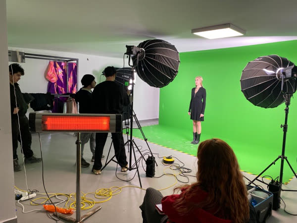 Green-screen studio setup with cameras, lighting, and a performer for Nova Replica.